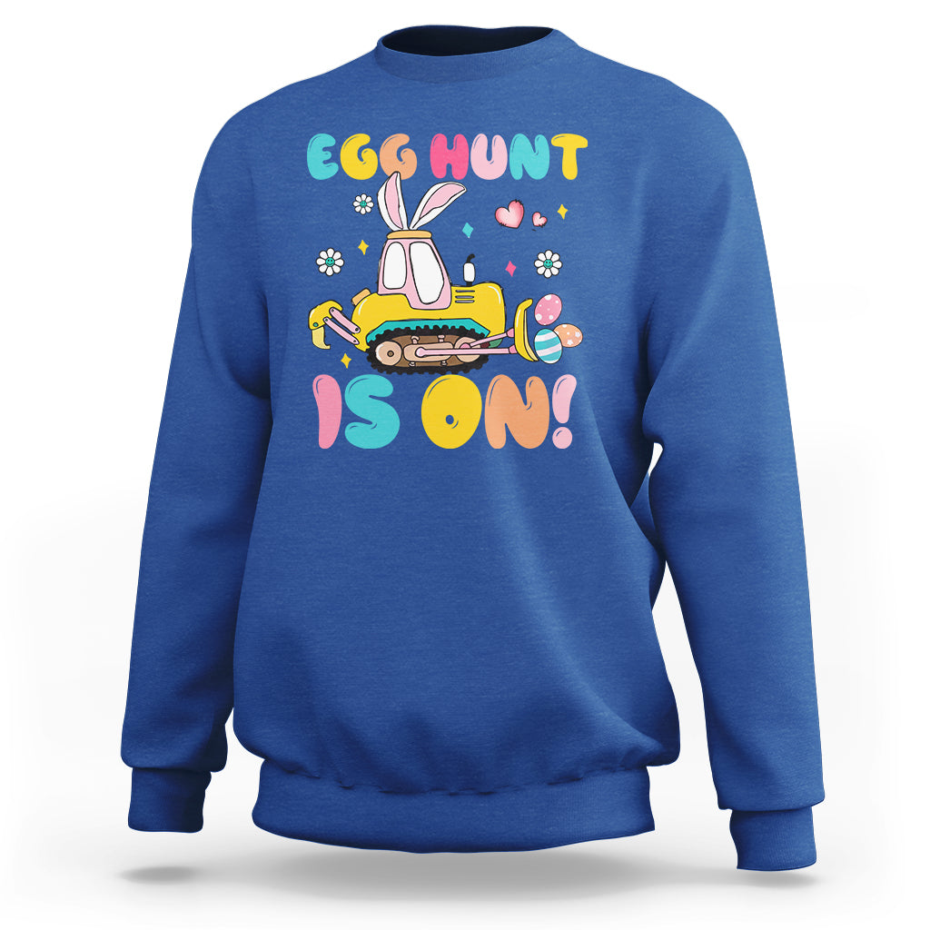 Royal blue Easter egg hunt sweatshirt with bunny tractor graphic and colorful text