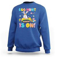 Royal blue Easter egg hunt sweatshirt with bunny tractor graphic and colorful text