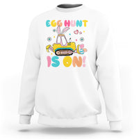 White Easter egg hunt sweatshirt with bunny tractor graphic and colorful text