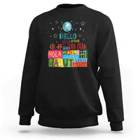Black crewneck sweatshirt with “Hello” graphic and multicolor globe print on front.