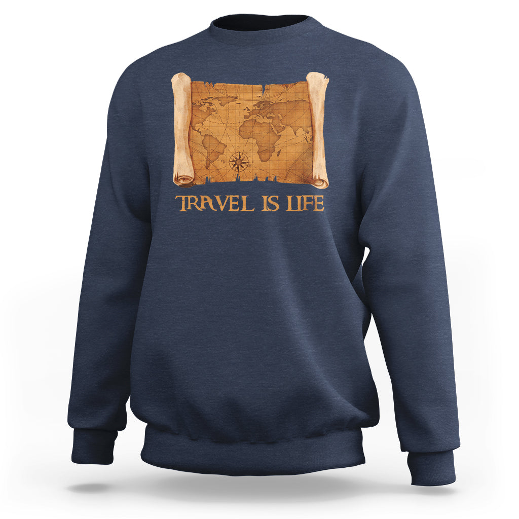 Blue crewneck sweatshirt with vintage world map scroll graphic and “Travel is Life” text