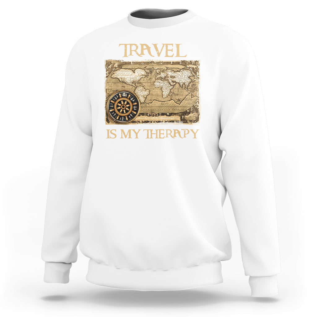 White travel-themed sweatshirt with vintage world map and compass graphic, front view