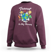 Maroon crewneck sweatshirt with globe graphic and 'Is My Therapy' wording.