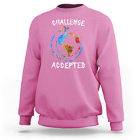 Azalea pink crewneck sweatshirt with globe graphic and "CHALLENGE ACCEPTED" print