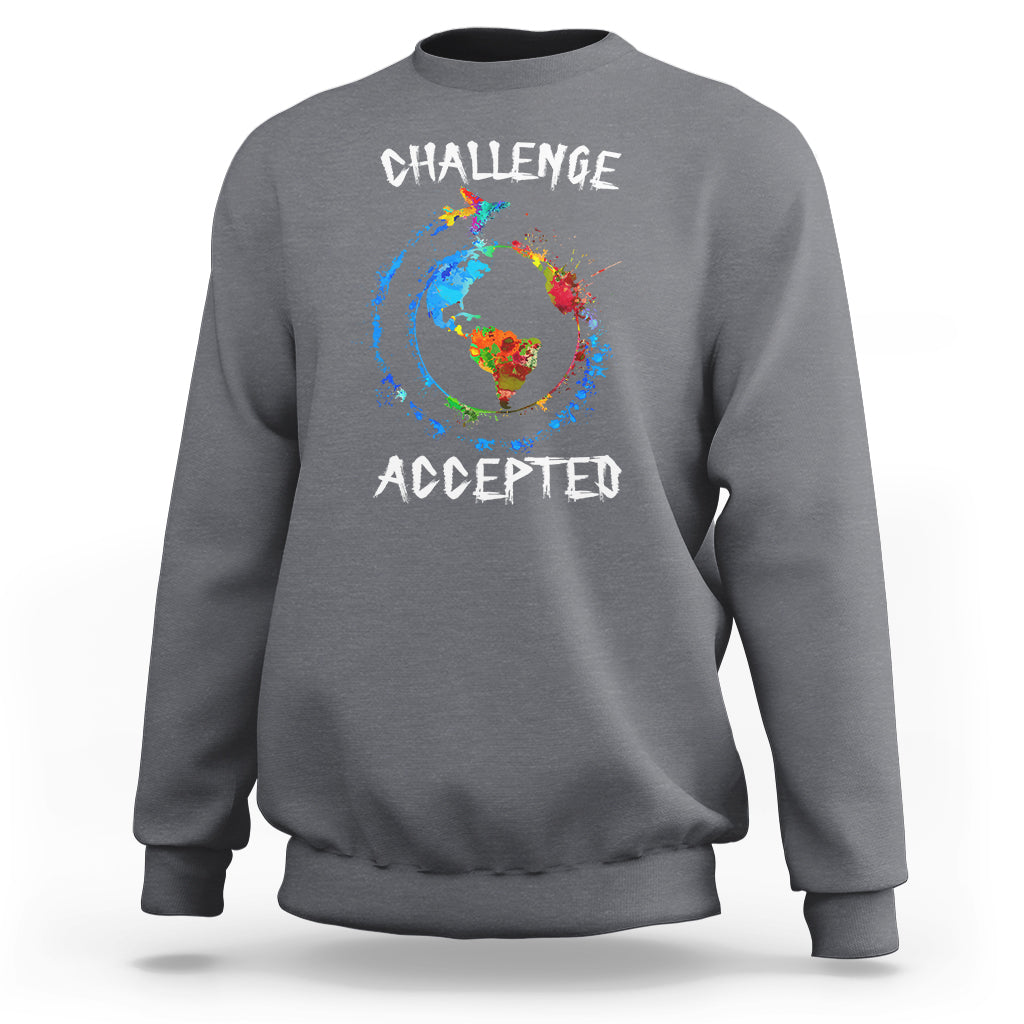 Charcoal crewneck sweatshirt with globe graphic and "CHALLENGE ACCEPTED" print