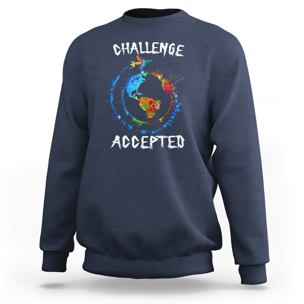Navy crewneck sweatshirt with globe graphic and "CHALLENGE ACCEPTED" print