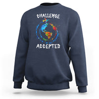 Navy crewneck sweatshirt with globe graphic and "CHALLENGE ACCEPTED" print