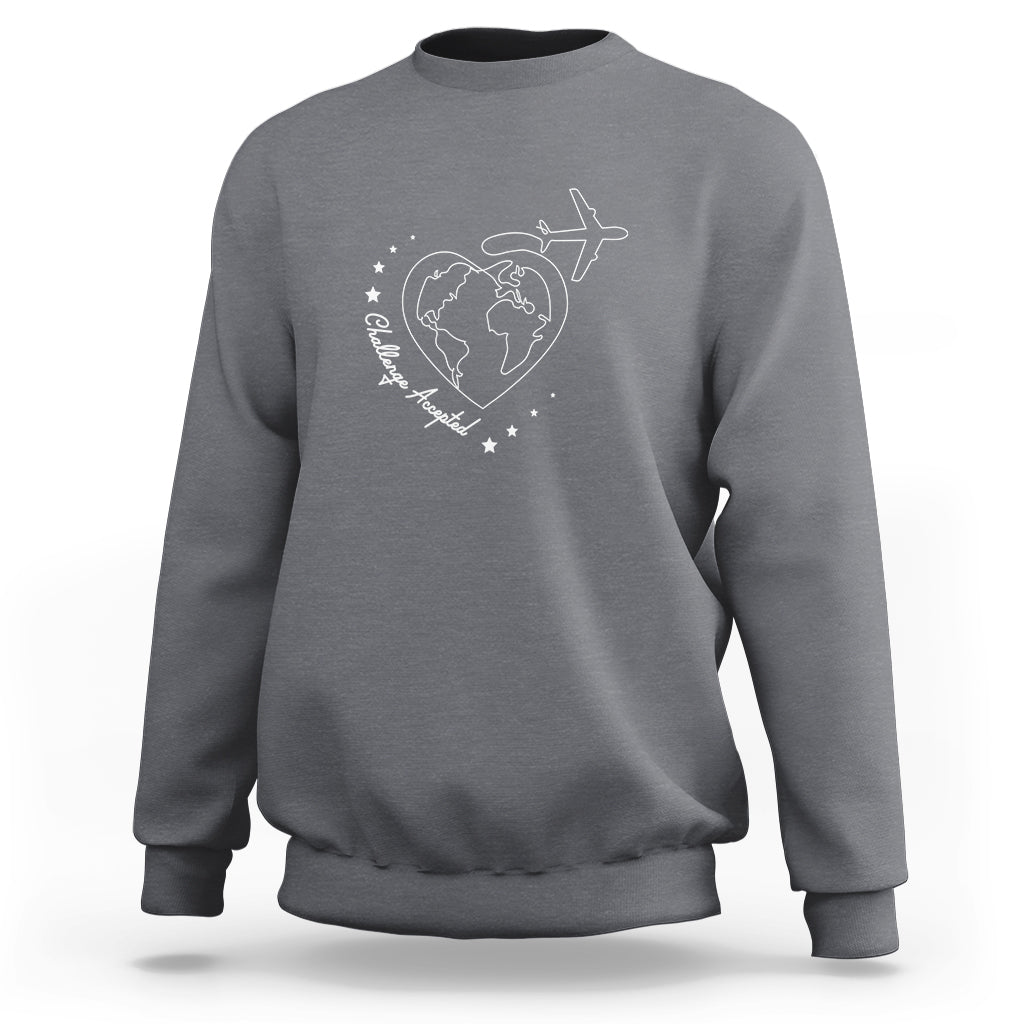 Charcoal gray crewneck sweatshirt with white globe, airplane, and heart graphic on chest