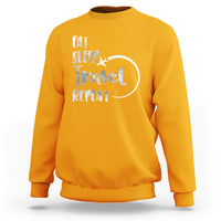 Gold crewneck sweatshirt with 'Eat Sleep Travel Repeat' graphic on back.