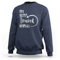 Navy crewneck sweatshirt with 'Eat Sleep Travel Repeat' graphic on back.