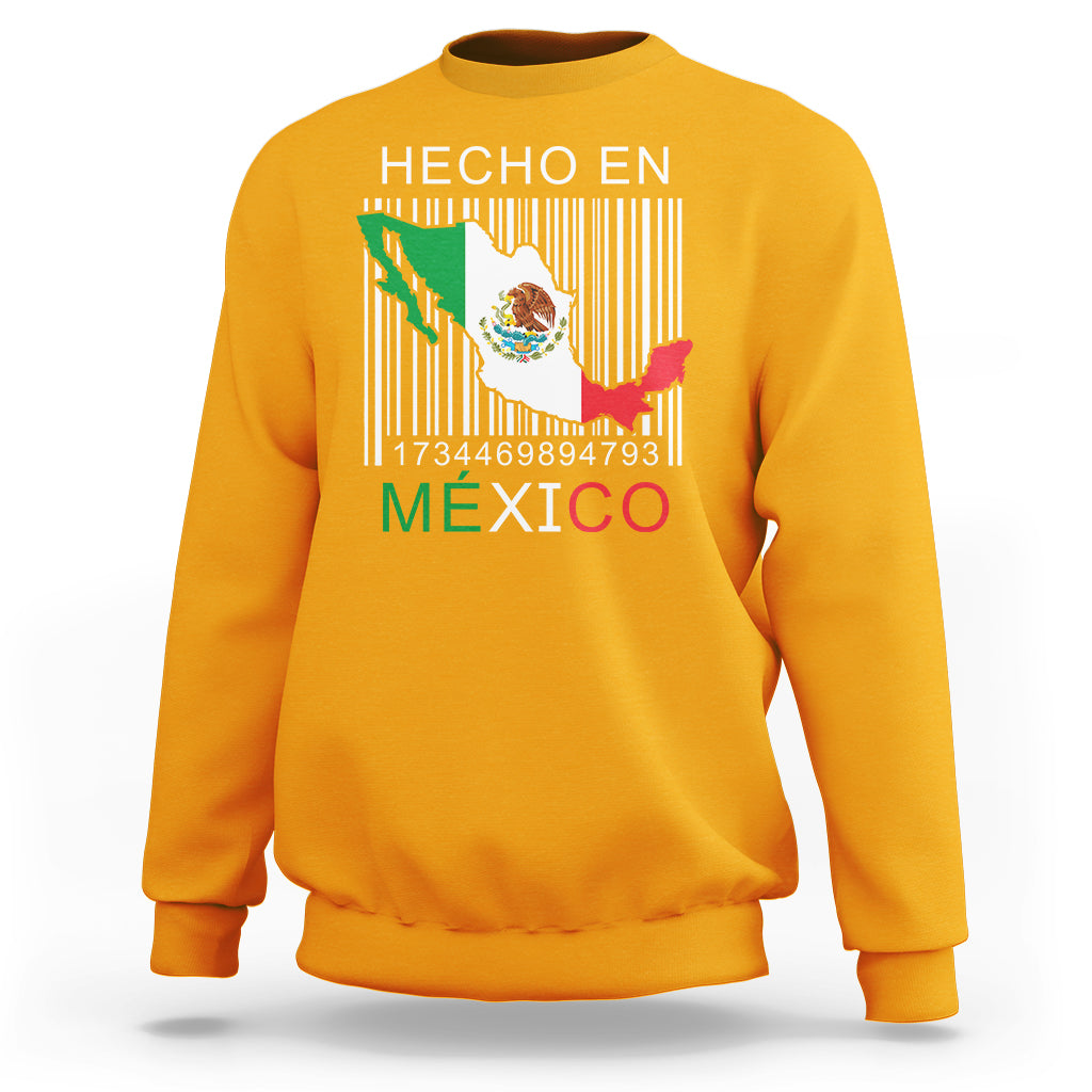 Gold crewneck sweatshirt with 'HECHO EN MEXICO' barcode flag graphic on chest