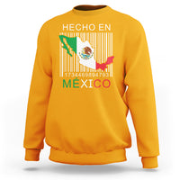 Gold crewneck sweatshirt with 'HECHO EN MEXICO' barcode flag graphic on chest
