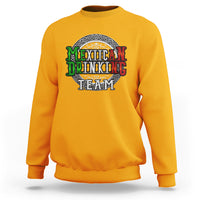 Gold crewneck sweatshirt with circular 'Mexican Drinking Team' graphic