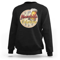 Black sweatshirt with “Necesito Cerveza” beer graphic