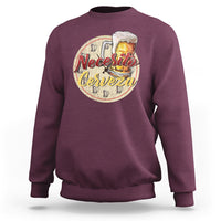 Maroon sweatshirt with “Necesito Cerveza” beer graphic