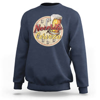 Navy sweatshirt with “Necesito Cerveza” beer graphic