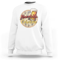 White sweatshirt with “Necesito Cerveza” beer graphic