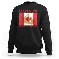 Black crewneck sweatshirt with “CANADA” graphic and “NOT JUST COLDER, COOLER” text
