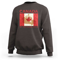 Dark brown crewneck sweatshirt with “CANADA” graphic and “NOT JUST COLDER, COOLER” text