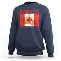 Navy crewneck sweatshirt with “CANADA” graphic and “NOT JUST COLDER, COOLER” text