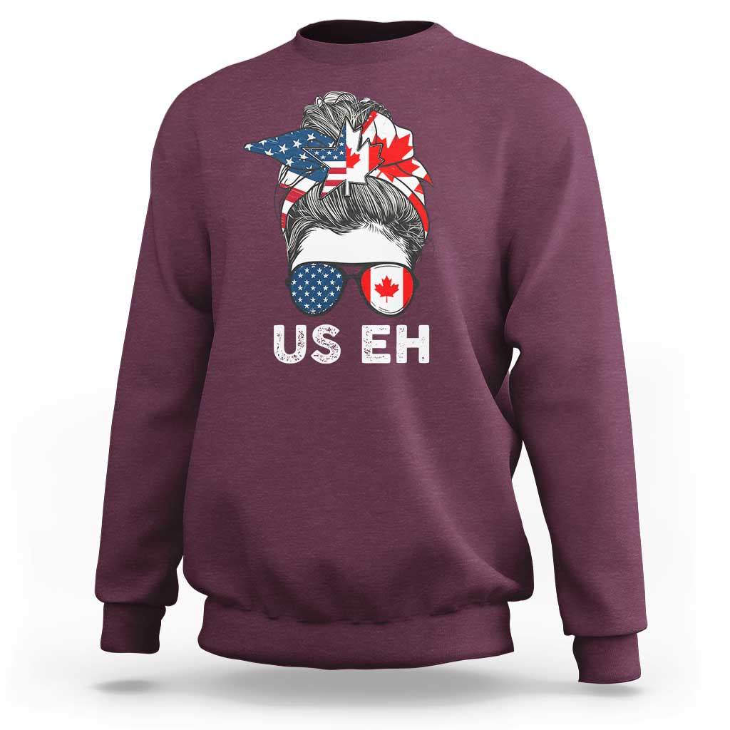 Maroon crewneck sweatshirt with US EH graphic and Canada–US flag hair illustration