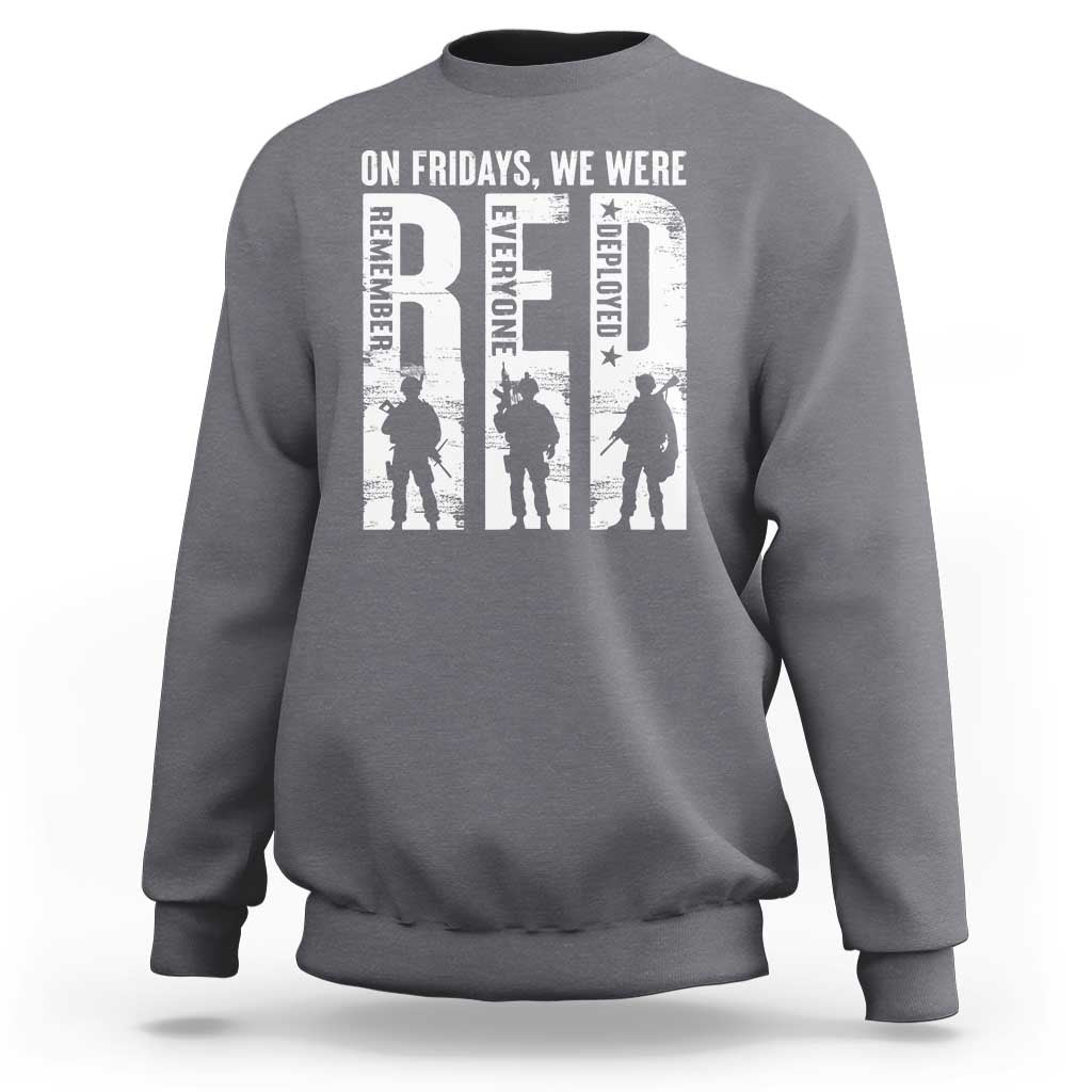 Gray crewneck sweatshirt with white graphic text and soldier silhouettes on chest