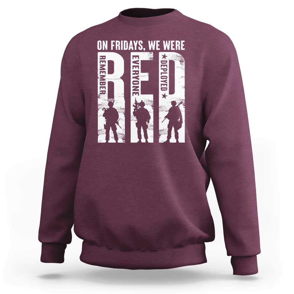 Maroon crewneck sweatshirt with white graphic text and soldier silhouettes on chest