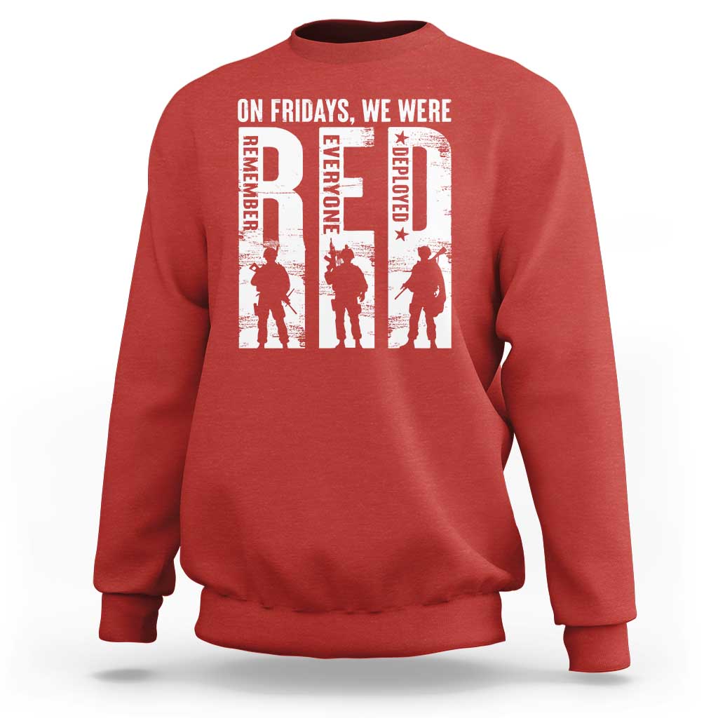 Red crewneck sweatshirt with white graphic text and soldier silhouettes on chest