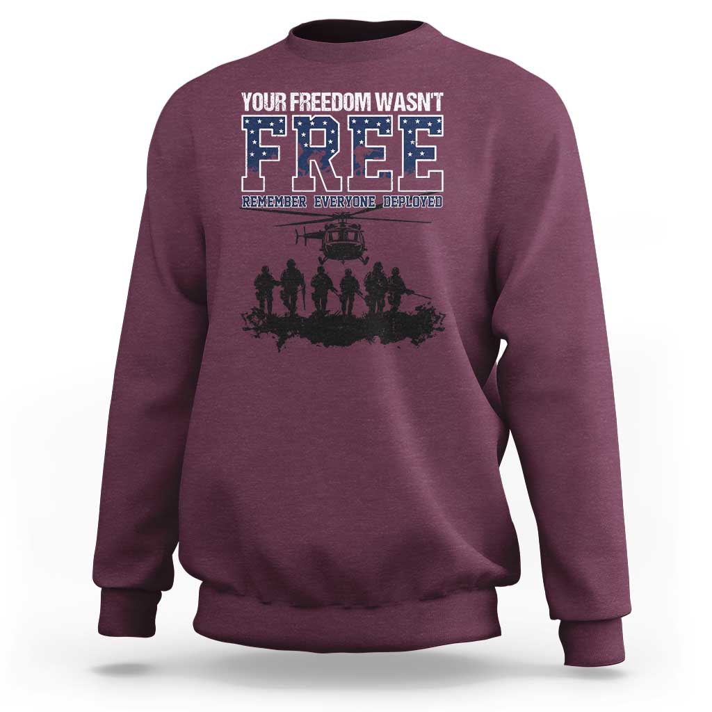 Maroon crewneck sweatshirt with front “Free” graphic and deployed memorial text