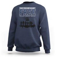 Navy crewneck sweatshirt with front “Free” graphic and deployed memorial text