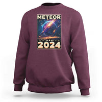 Maroon astronomy sweatshirt with “Meteor 2024” back graphic