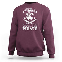 Maroon crewneck sweatshirt with long sleeves and white “Princess” pirate graphic on back