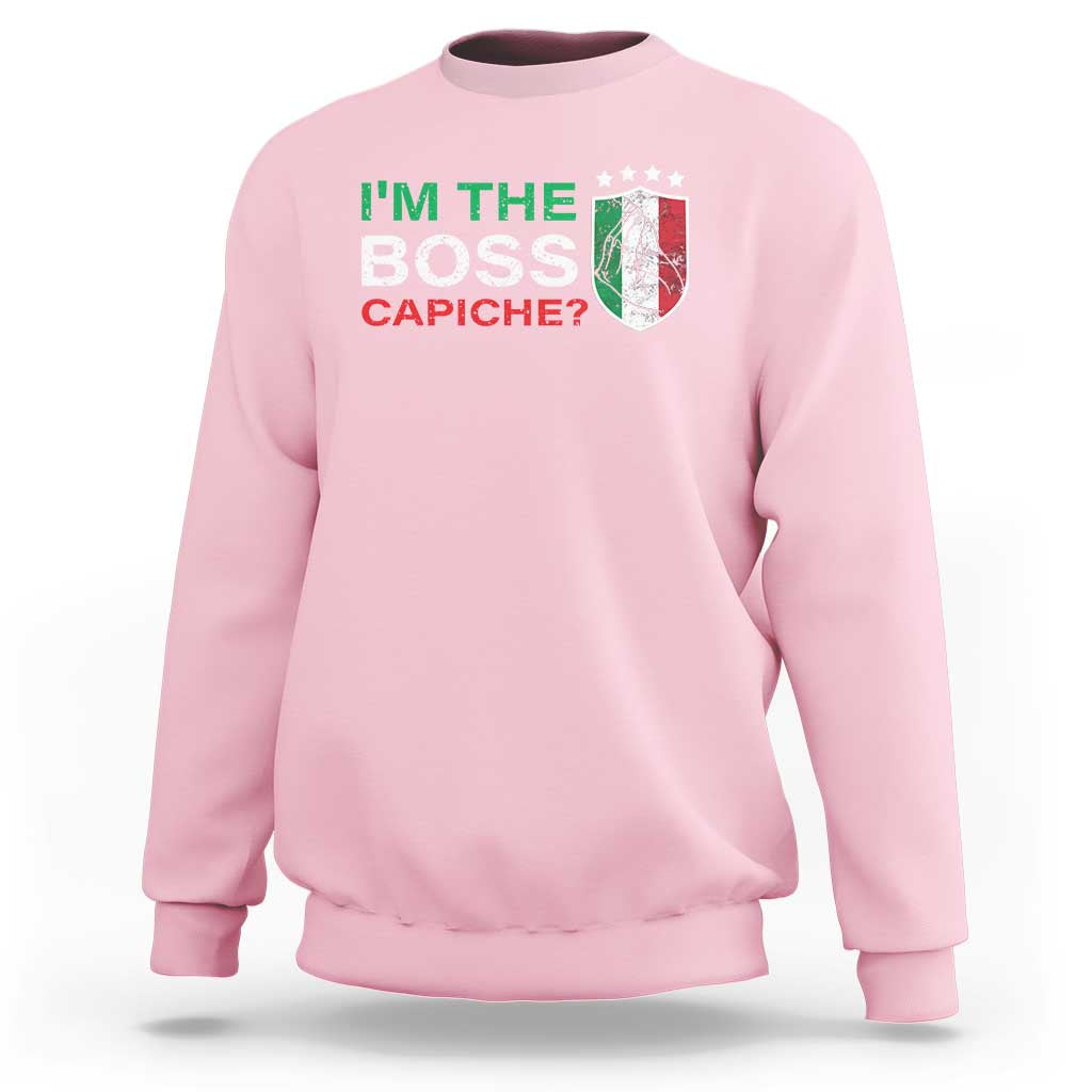 Light pink crewneck sweatshirt with "I'm the Boss Capiche?" graphic on chest