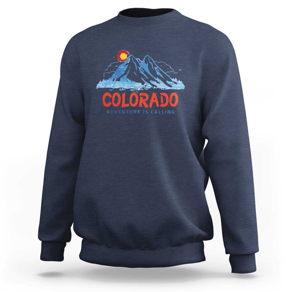 Navy crewneck sweatshirt with Colorado mountain graphic and 'Adventure Is Calling' print