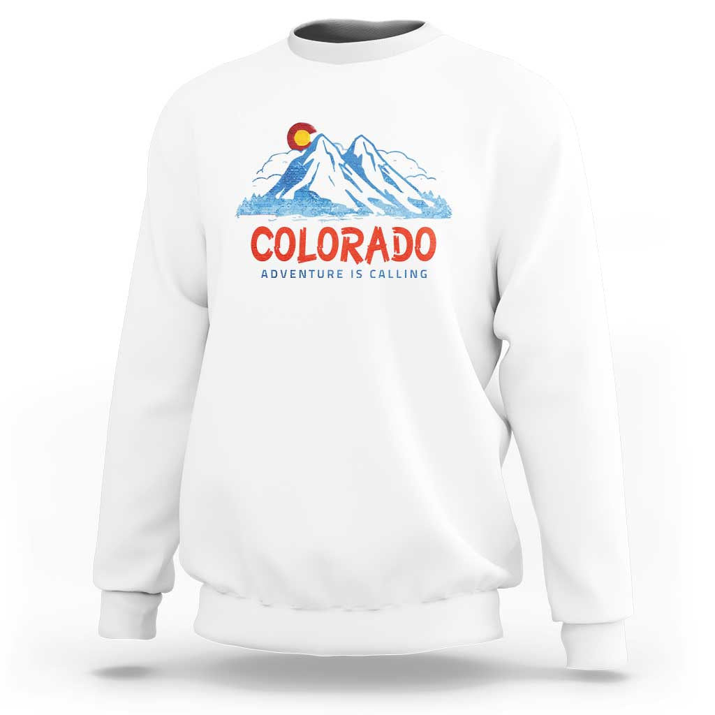 White crewneck sweatshirt with Colorado mountain graphic and 'Adventure Is Calling' print