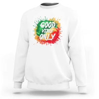 White crewneck sweatshirt with colorful “Good Vibes Only” rasta graphic on front