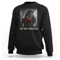 Black crewneck sweatshirt with wolf graphic and "They Don't Understand" print