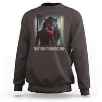 Dark chocolate crewneck sweatshirt with wolf graphic and "They Don't Understand" print