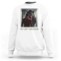 White crewneck sweatshirt with wolf graphic and "They Don't Understand" print