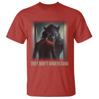 Red graphic T-shirt with wolf artwork and “THEY DON'T UNDERSTAND” text on front