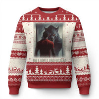 Red Christmas sweater with wolf graphic in center and white tree and snowflake pattern