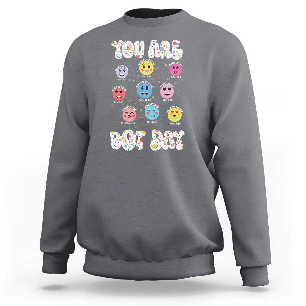 Charcoal gray crewneck sweatshirt with colorful dot-face graphic and 'YOU ARE DOT DAY' print.