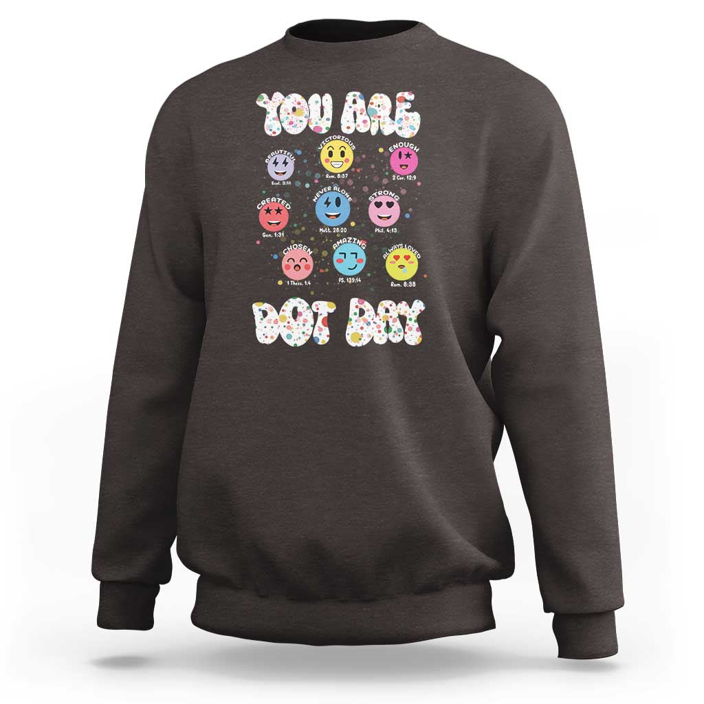 Dark chocolate crewneck sweatshirt with colorful dot-face graphic and 'YOU ARE DOT DAY' print.