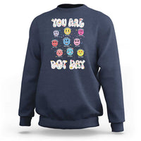 Navy crewneck sweatshirt with colorful dot-face graphic and 'YOU ARE DOT DAY' print.