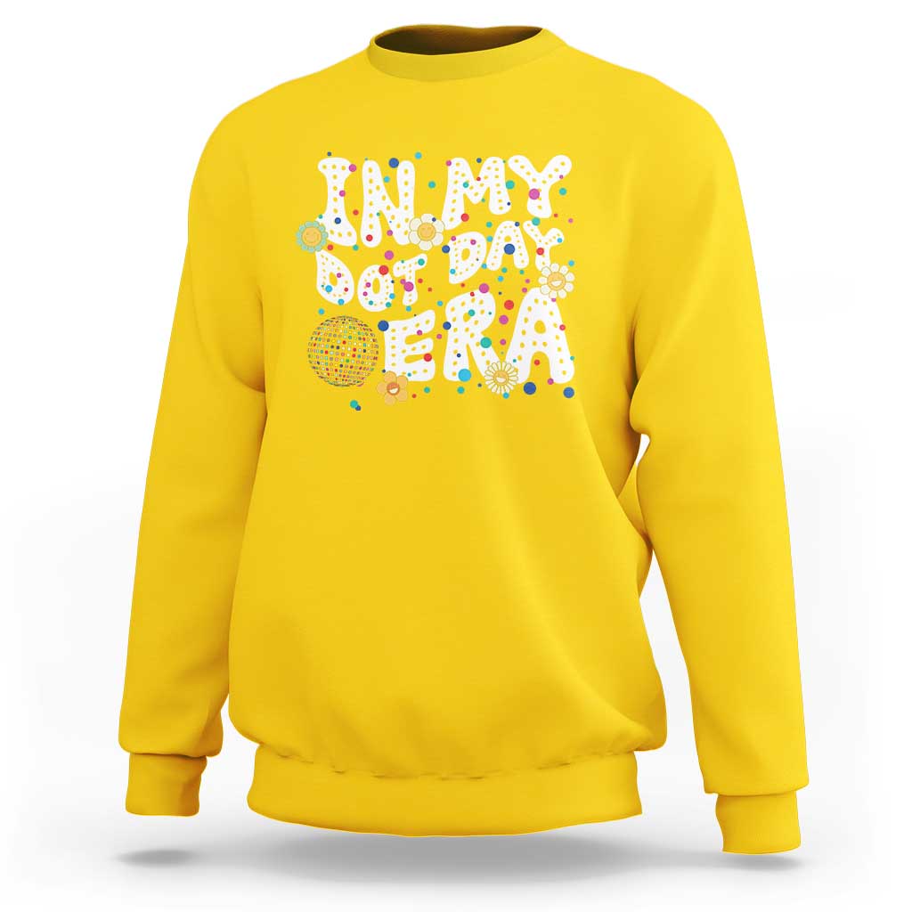 Yellow crewneck sweatshirt with colorful 'Happy Dot Day' graphic front