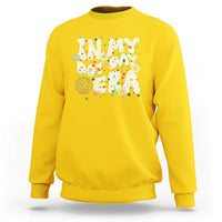 Yellow crewneck sweatshirt with colorful 'Happy Dot Day' graphic front