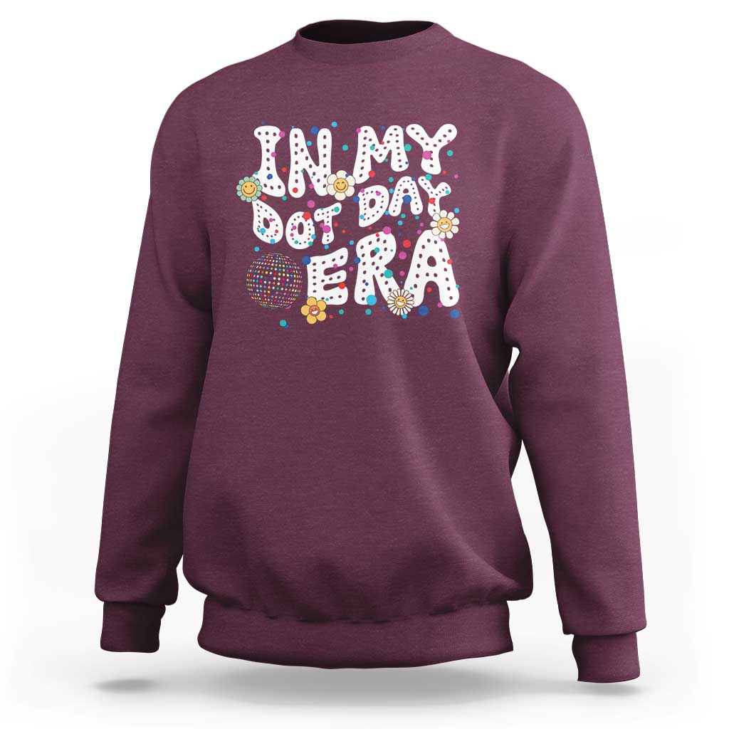 Maroon crewneck sweatshirt with colorful 'Happy Dot Day' graphic front