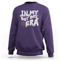 Purple crewneck sweatshirt with colorful 'Happy Dot Day' graphic front