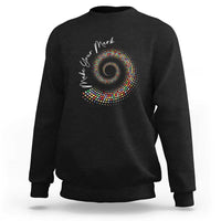 Black sweatshirt with colorful dot spiral graphic on chest