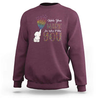 Maroon sweatshirt with cute elephant and rainbow dot graphic on front